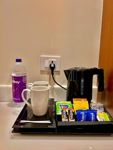 a counter top with a coffee maker and a coffee pot at Best Western Plus Amritsar in Amritsar
