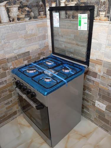 a stove with a blue top in a room at Villamar Sea View rooms & apartments in Hurghada