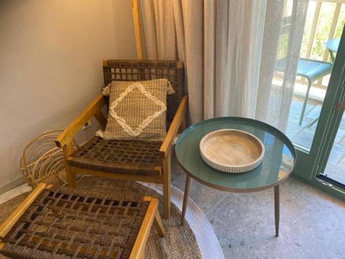 a living room with a table and a chair at Pelikastri in Promírion