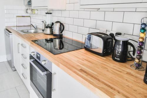 a kitchen with a counter top with a toaster and a toaster at The Lookout - Hastings in Hastings