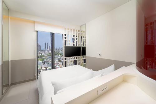 Postel nebo postele na pokoji v ubytování Wink Hotel Saigon Centre - 24hrs Lifestyle Stay