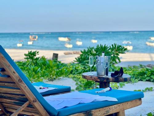 a table with a blender on the beach at Infinity Beach Boutique Hotel & SPA in Matemwe