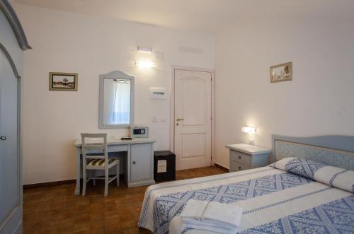Ένα ή περισσότερα κρεβάτια σε δωμάτιο στο Hotel Sandalyon