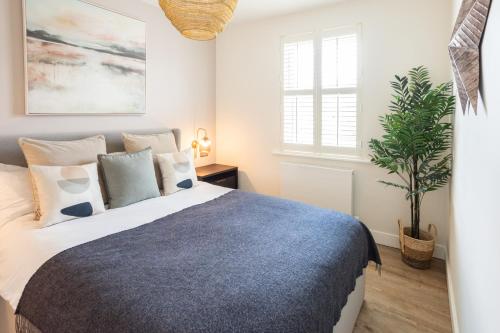 a bedroom with a bed and a potted plant at Host & Stay - The School House in Hereford