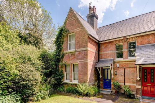 an old brick house with a red door at The Writers Retreat- Hastings in Hastings