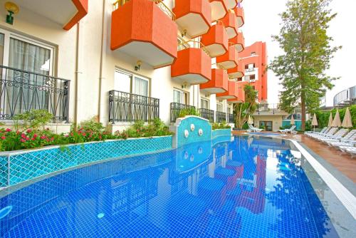 a swimming pool in front of a building at Antique Roman Palace Museum Hotel - Adults Only Ultra All Inclusive in Alanya