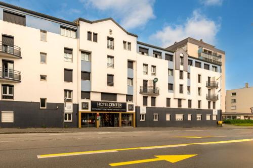 an empty street in front of a building at Logis Hotel Center in Brest
