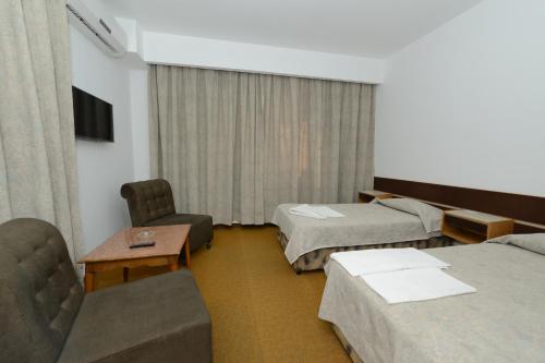 Postel nebo postele na pokoji v ubytování Rivoli Hotel Jerusalem