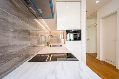 a kitchen with a sink and a counter top at West 21 Tower in Fontana