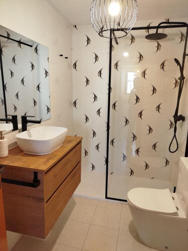 a bathroom with a sink and a toilet and a shower at Milion Destiny Entre Playas in Oropesa del Mar