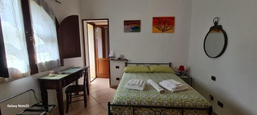 Postel nebo postele na pokoji v ubytování B&B Brezza di Mare (Sea Breeze)