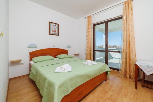 Postel nebo postele na pokoji v ubytování Rooms Mande