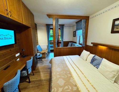 Postel nebo postele na pokoji v ubytování Hotel Na Dolině