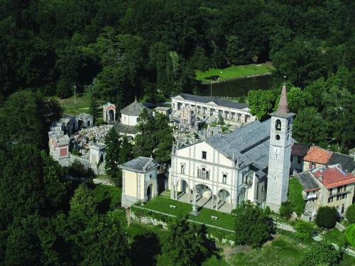 an aerial view of a large white building with a tower at Casa della Musica in Verbania