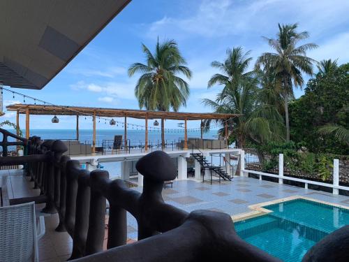 a view from the balcony of a resort with a swimming pool at Paradise Bungalows in Haad Rin