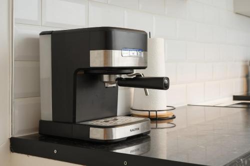 a coffee maker on a counter in a kitchen at Grimsby City Centre stay in Grimsby
