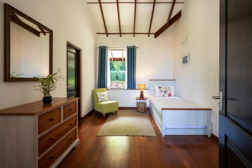 מיטה או מיטות בחדר ב-Camellia Hills
