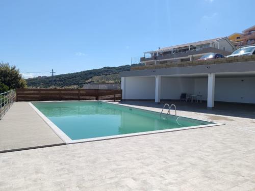 a swimming pool on top of a building at Appartamento Il Tramonto in Castelsardo