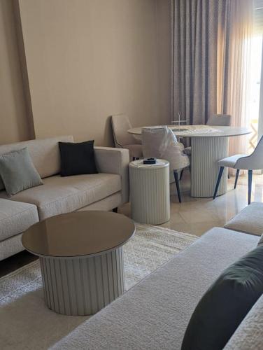 a living room with two couches and a table at Dar soufia in Nabeul