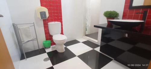 a bathroom with a toilet and a sink at APART 2 Alojamento Para Turismo e Negócios in Braga