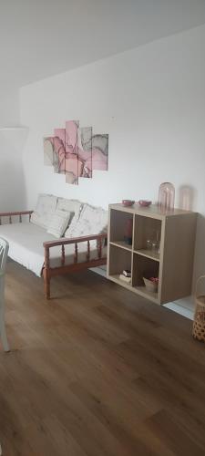 a bedroom with a bed and a cabinet in it at Apartamentos Can Salas in Cala Figuera