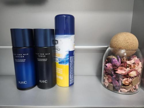 a group of three products sitting on a shelf at Daegu Star B&B DSR Hotel lily in Daegu