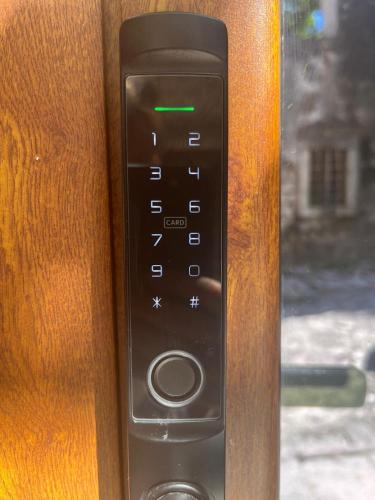 a close up of a remote control on a door at The Oldest Street Apartment - TOSA in Risan