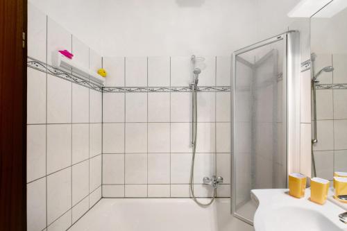 a bathroom with a shower and a sink at Der Falkenhorst in Bad Sachsa