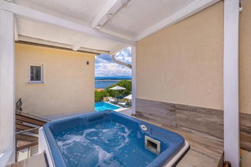 a jacuzzi tub in a room with a view at Hot Tub, Pool & Stunning View #Guest House Stella# in Dramalj