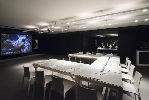 a conference room with a long table and chairs at President Hotel Athens in Athens