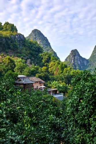 a view of a valley with mountains in the background at Yangshuo Yunshe Mountain Guesthouse in Yangshuo