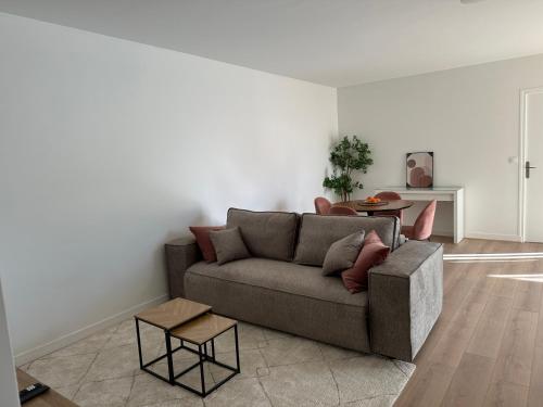 Ruang duduk di Appartement proche Paris-Aéroport CDG-Gare-Disney