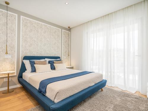 Ένα ή περισσότερα κρεβάτια σε δωμάτιο στο Luxury and Comfort Next to the Historic Center #1954