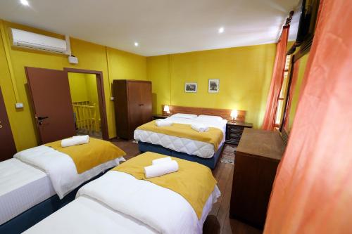 Postel nebo postele na pokoji v ubytování Guesthouse n'Odë