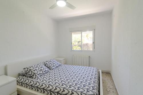 En eller flere senge i et værelse på Club Villamar - Juliana