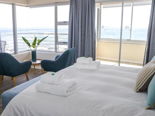 Ένα ή περισσότερα κρεβάτια σε δωμάτιο στο Ocean View Properties - Apartment 701