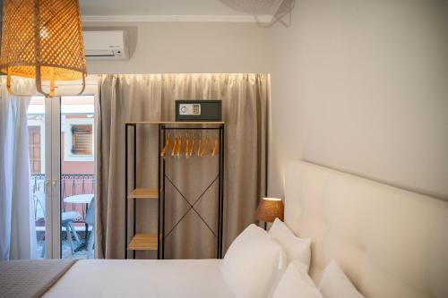 Ένα ή περισσότερα κρεβάτια σε δωμάτιο στο Avra Hotel 2