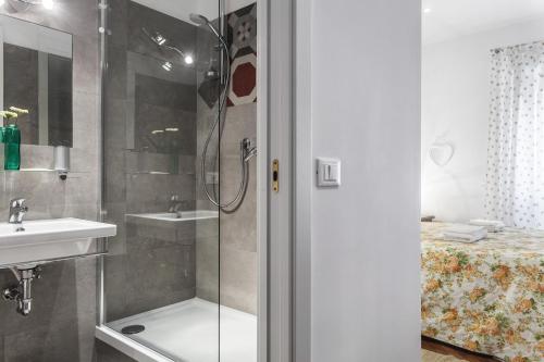 a bathroom with a shower and a sink at Le Scalette Al Vaticano B&B in Rome