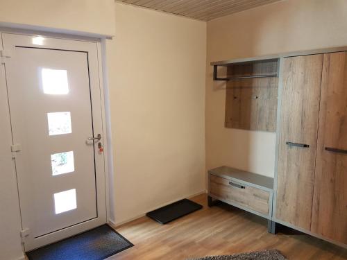 a room with a closet and a door and a desk at Ruth in Dahn