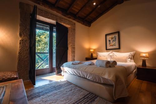 Ένα ή περισσότερα κρεβάτια σε δωμάτιο στο Quinta do Caneiro