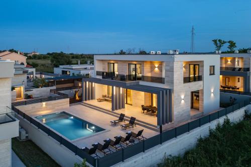 an aerial view of a house with a swimming pool at Villa Roko Nin ZadarVillas in Nin