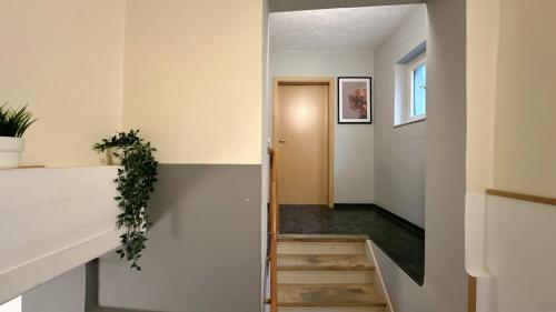 a stairwell leading to the hallway of a house at Monteurunterkunft Komfort Plus in Hörstel