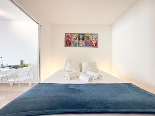 a bedroom with a large bed with towels on it at Palais Josephine 1BR Bnbrickeys in Beausoleil