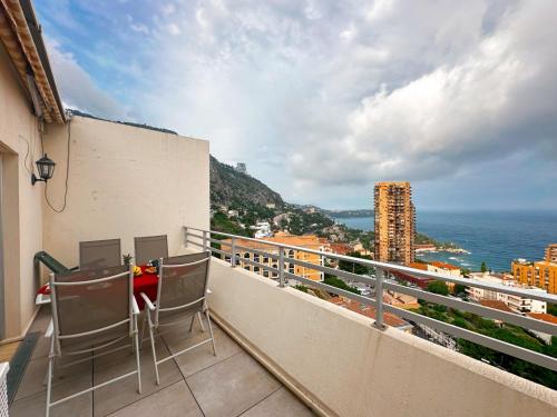 a balcony with chairs and a view of the ocean at Monaco Dream Seaview, Bnbrickeys in Beausoleil