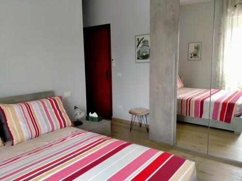 Postel nebo postele na pokoji v ubytování SERENDIPITY B&b