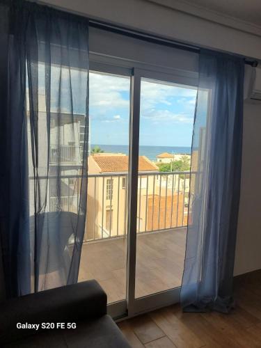 a room with a large window with a view of the ocean at Bella Vista 2 in Piles