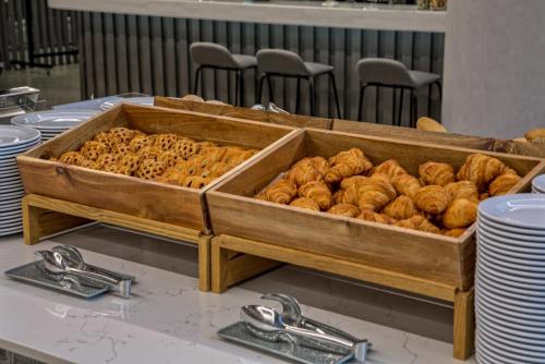 a tray of pastries sitting on a table at Focus Hotel Premium Warszawa in Warsaw
