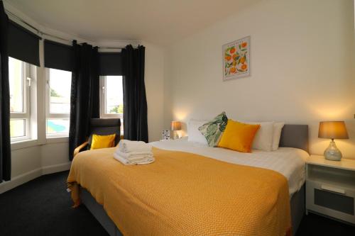 a bedroom with two beds and a window at Signature - Gartlea House in Airdrie