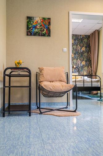 a room with two beds and a pillow on a chair at Diamond dream in Ptuj