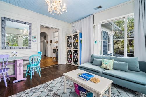 a living room with a blue couch and a table at Birmingham Tree House in Birmingham